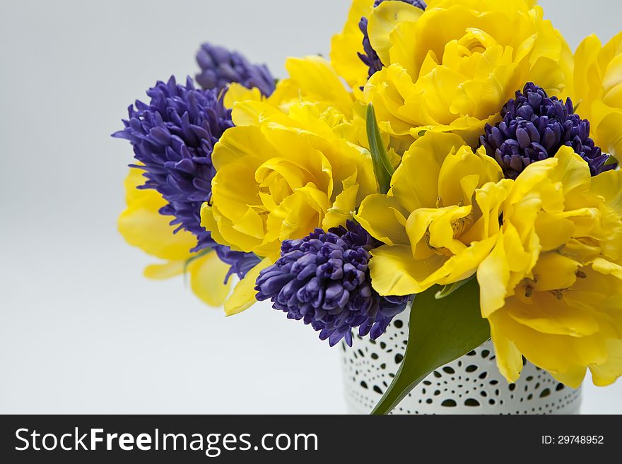 Beautiful spring bouquet of hyacinths and yellow tulips with space for text. Beautiful spring bouquet of hyacinths and yellow tulips with space for text.