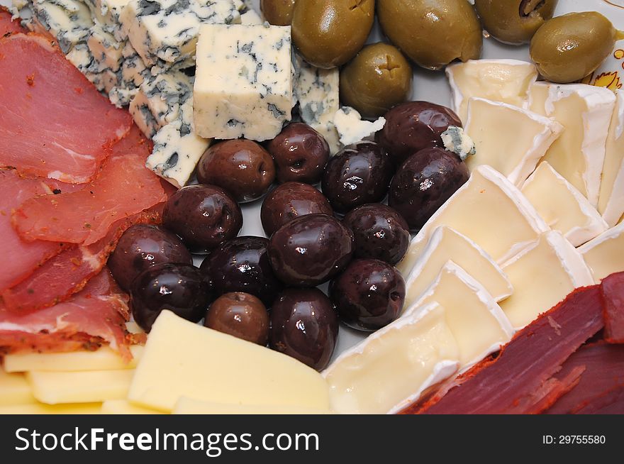 Catering food, cheese, olives and jerked meat