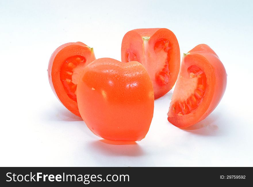 Ripe tomato is divided into four parts