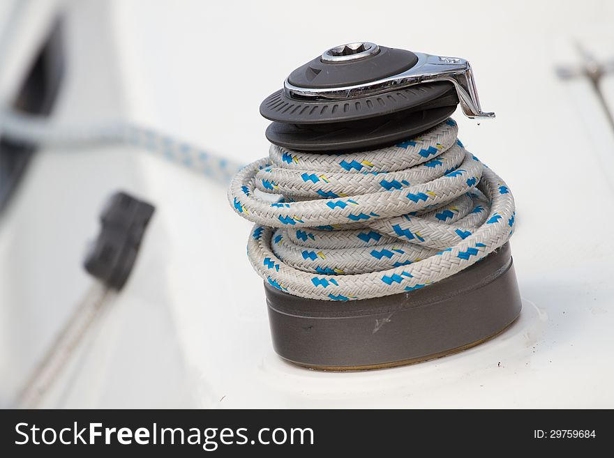 Winch and rope on a  yacht. Winch and rope on a  yacht