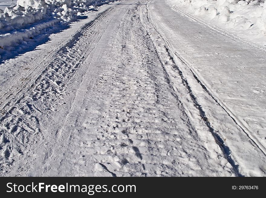 Close up of snowy road background, winter sunny day