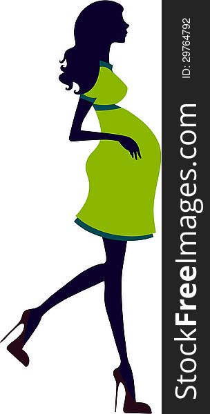 Silhouette of pregnant woman with green dress