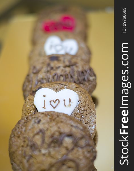 Brown cookies with chocolate and messages for Valentines Day. Brown cookies with chocolate and messages for Valentines Day