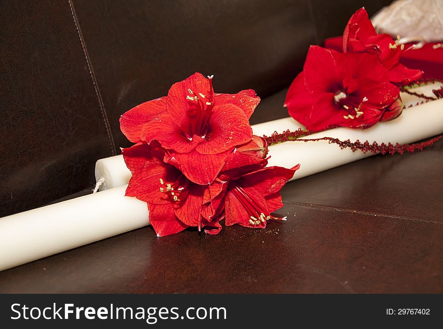 Beautiful wedding traditional candle with red flower ornaments