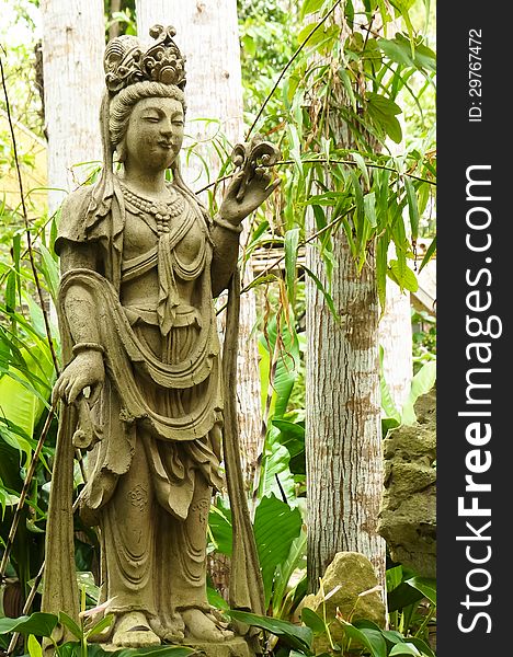 Picture of budhha statue in a garden