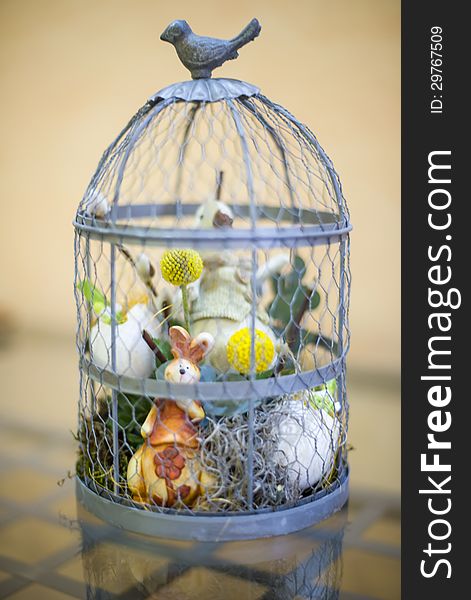Small steel cage arrangement with animals and symbols for Easter gifts. Small steel cage arrangement with animals and symbols for Easter gifts