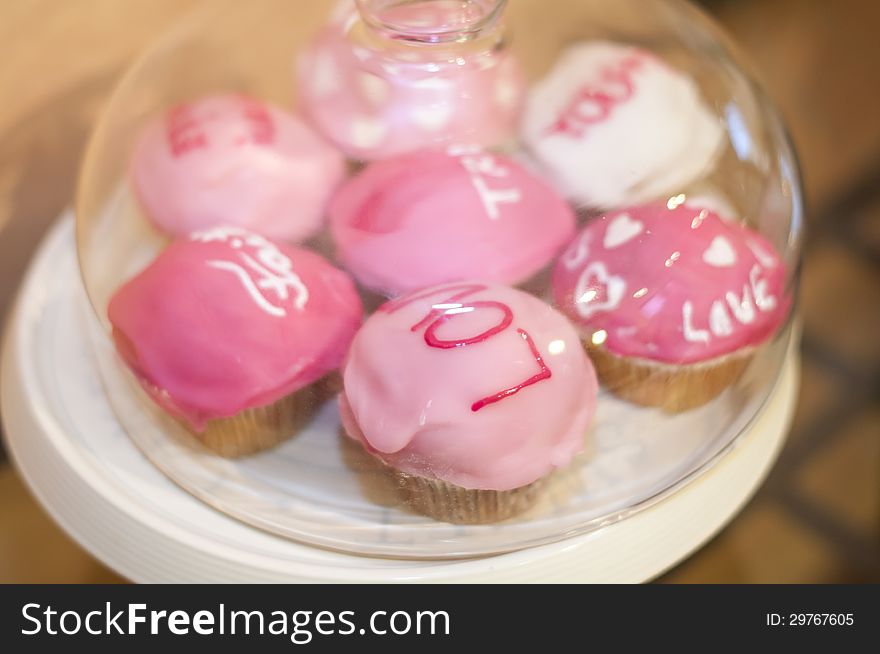 Sweet Pink Muffins With Messages In A Glass Bowl