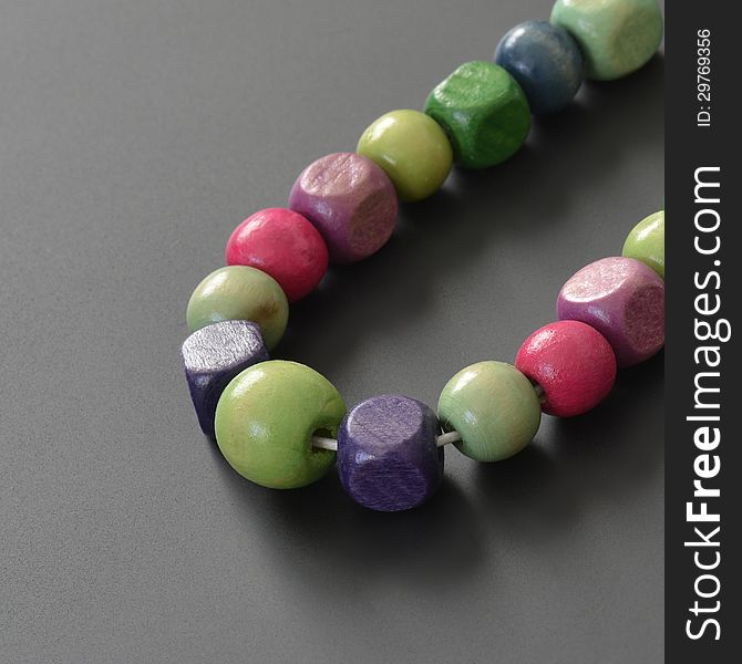 Necklace of wooden pearls with different colors