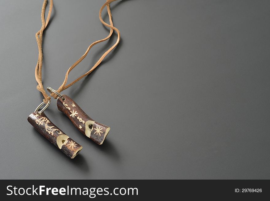 Crafts in reindeer horn with leather strap. Crafts in reindeer horn with leather strap