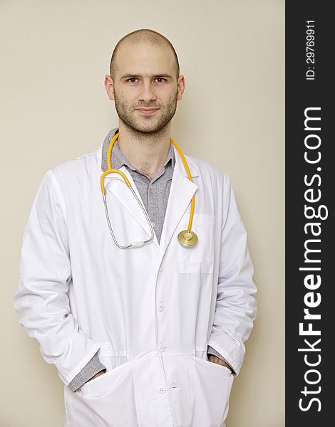 Portrait of a doctor of stethoscope isolated on light background