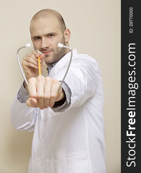 Portrait of a doctor of stethoscope isolated on light background