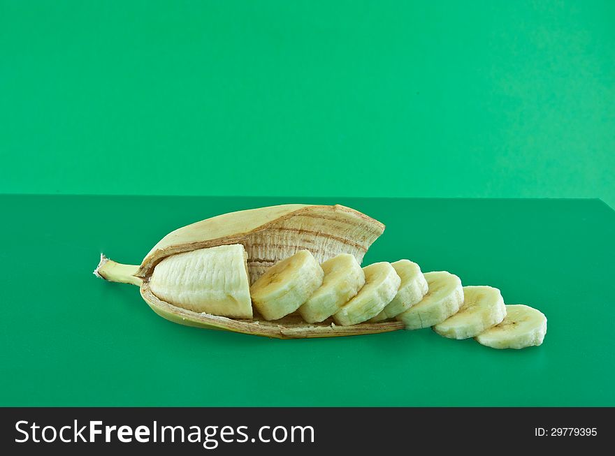 Banana sliced ​​into even circles lies in the cut peel. Banana sliced ​​into even circles lies in the cut peel