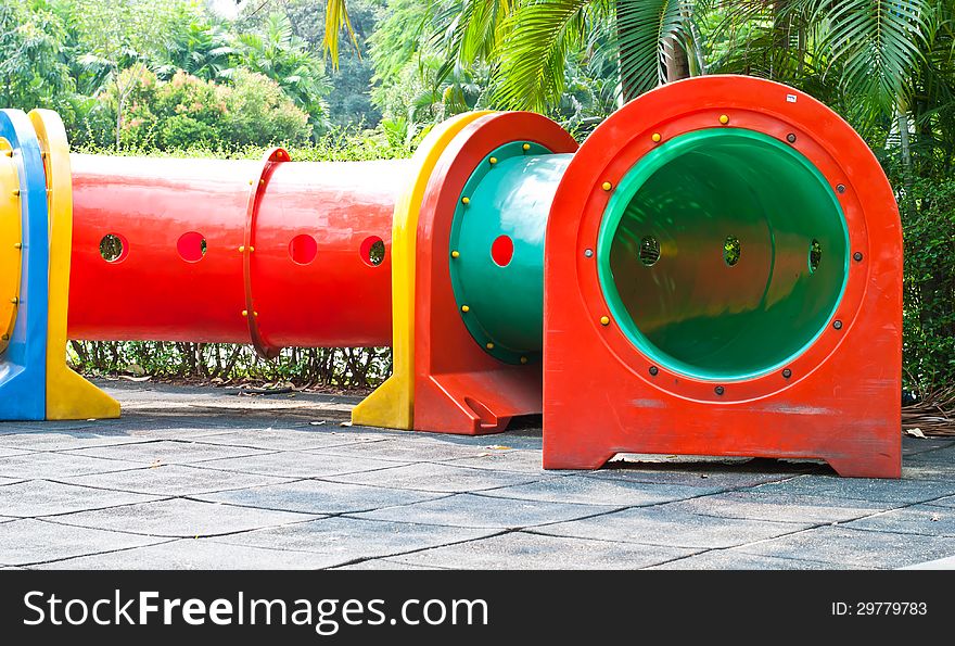 Colorful tube in playground of garden