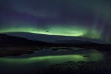 Northern Lights Above A Lagoon In Iceland Royalty Free Stock Images