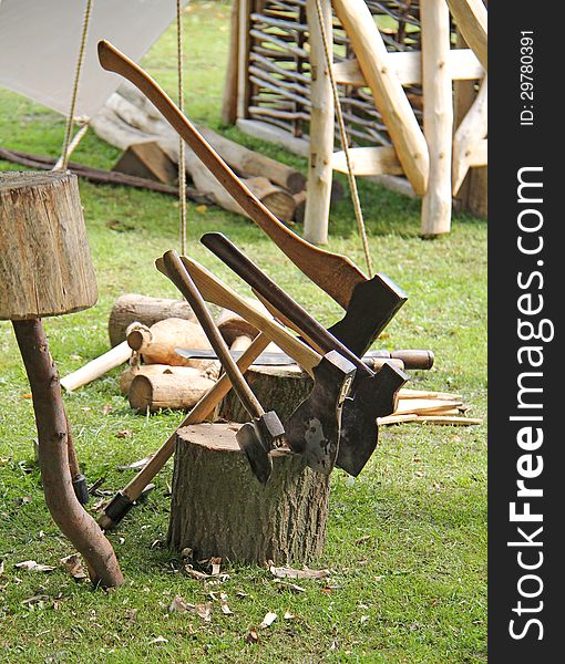 A Collection of Axes at a Wood Crafting Display. A Collection of Axes at a Wood Crafting Display.