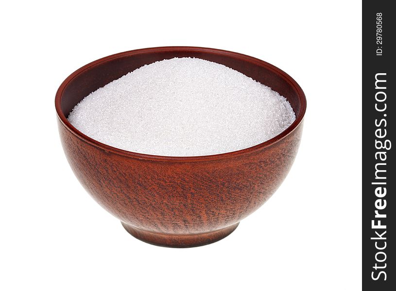 Sugar in the earthen bowl isolated on white background