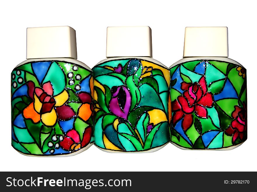 The photo shows three bottles pattern made in techno stained glass. color photos. The photo shows three bottles pattern made in techno stained glass. color photos.
