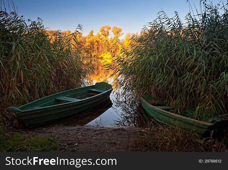 Boats on the quiet autumn lake