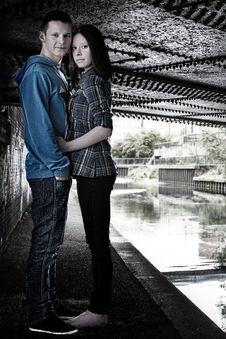 Young Cute Couple Hugging Under The Bridge Stock Photos Young Cute Couple Hugging Under The Bridge Stock Photos