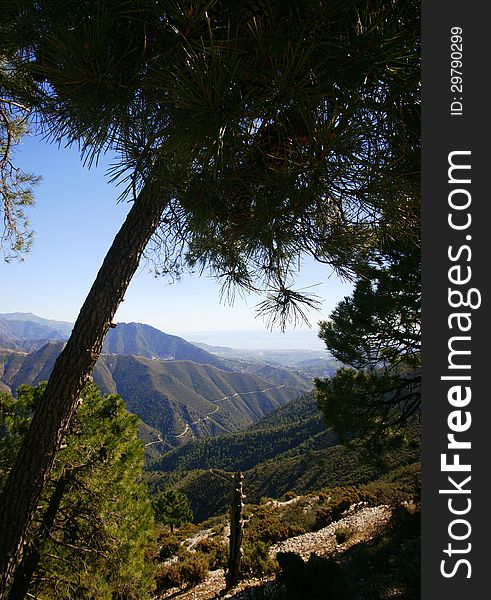 The mountains in the Malaga province near the towns of Competa and Nerja. The Mediterranean is in the distance. The mountains in the Malaga province near the towns of Competa and Nerja. The Mediterranean is in the distance.