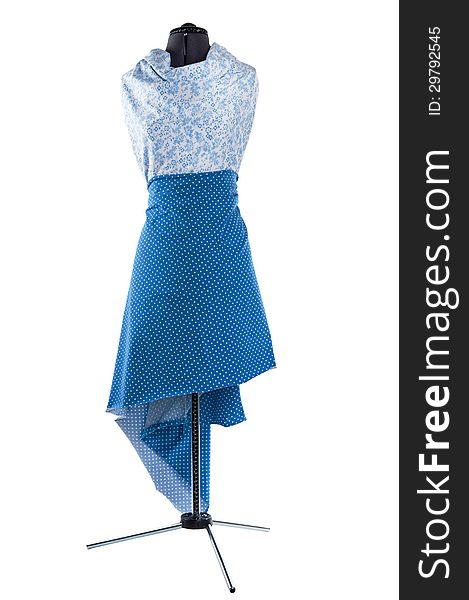 Manufacturing women's clothing from fabric on a mannequin. Manufacturing women's clothing from fabric on a mannequin