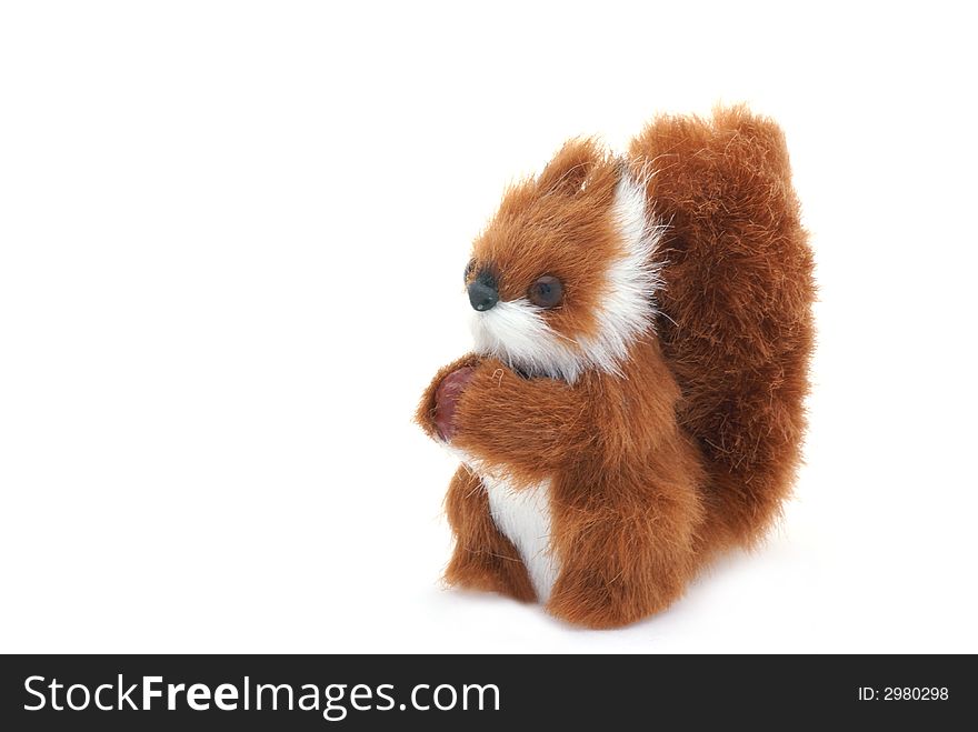 Cute plushy squirrel in front of a white background. Cute plushy squirrel in front of a white background.