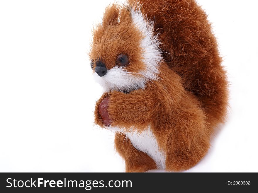 Cute plushy squirrel in front of a white background. Cute plushy squirrel in front of a white background.