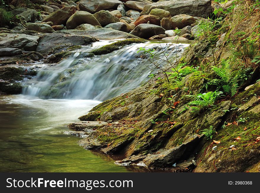 Little brook waterfall, summer season