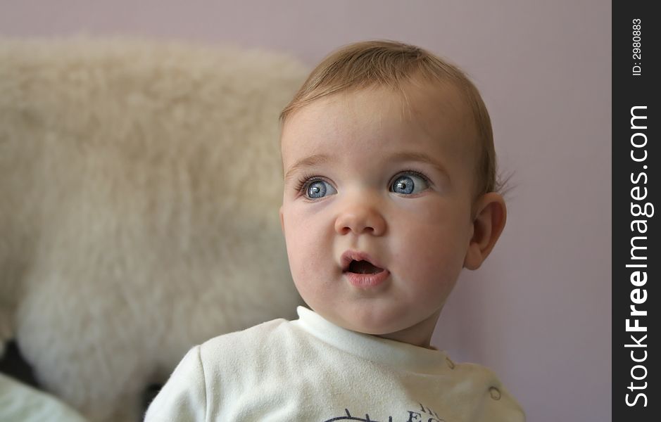 A portrait of a blue eyed baby.