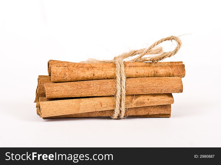 Cinnamon spicy sticks close-up isolated over a white background