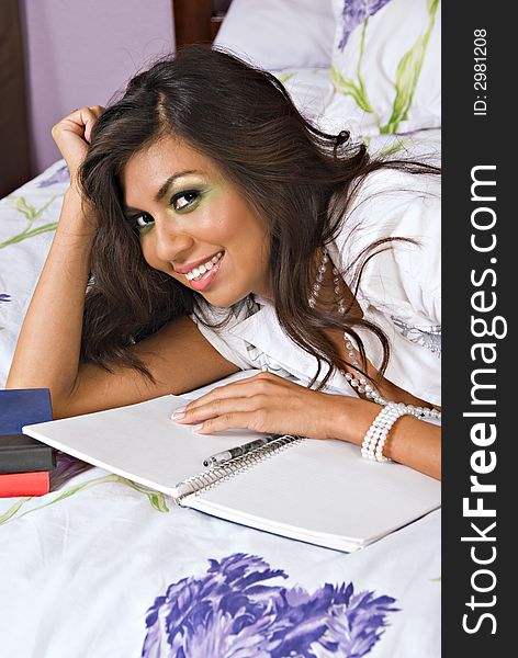 Hispanic Woman With Notebook