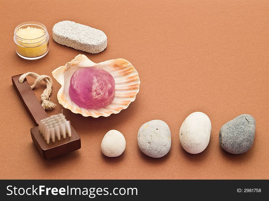 Spa arrangement with stones, brush, soap and marine salt