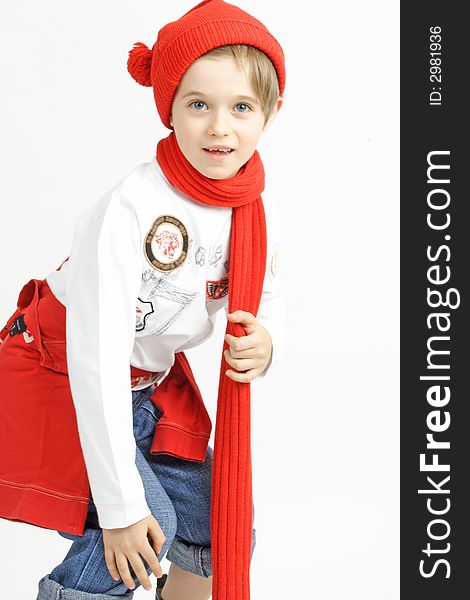 Smiling doy in a red cap and scarf. Smiling doy in a red cap and scarf