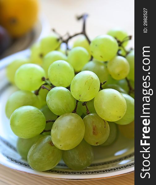 Green grapes on a plate