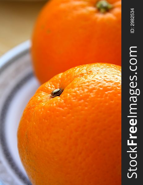 Oranges on a white plate