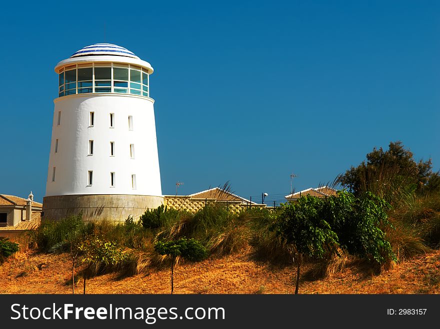 Lighthouse on the beach of ocean