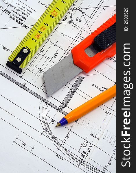 Ruler, penknife and pencil on a blue prints. Ruler, penknife and pencil on a blue prints