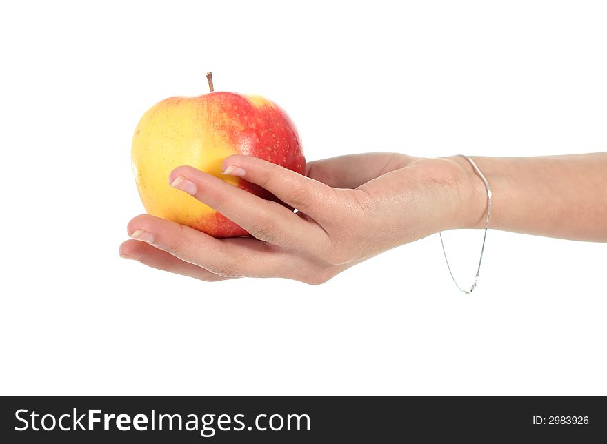 Red yellow apple in a hand.