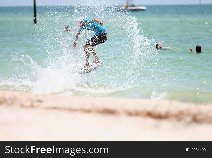 Jumping surfer in the ocean
