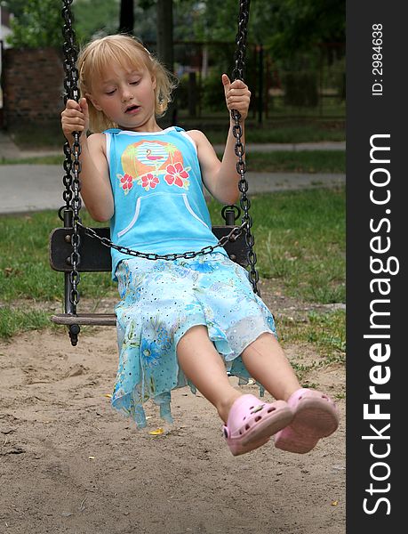 Little girl on the swing. Little girl on the swing