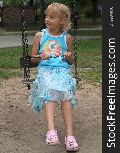 Little girl on the swing. Little girl on the swing