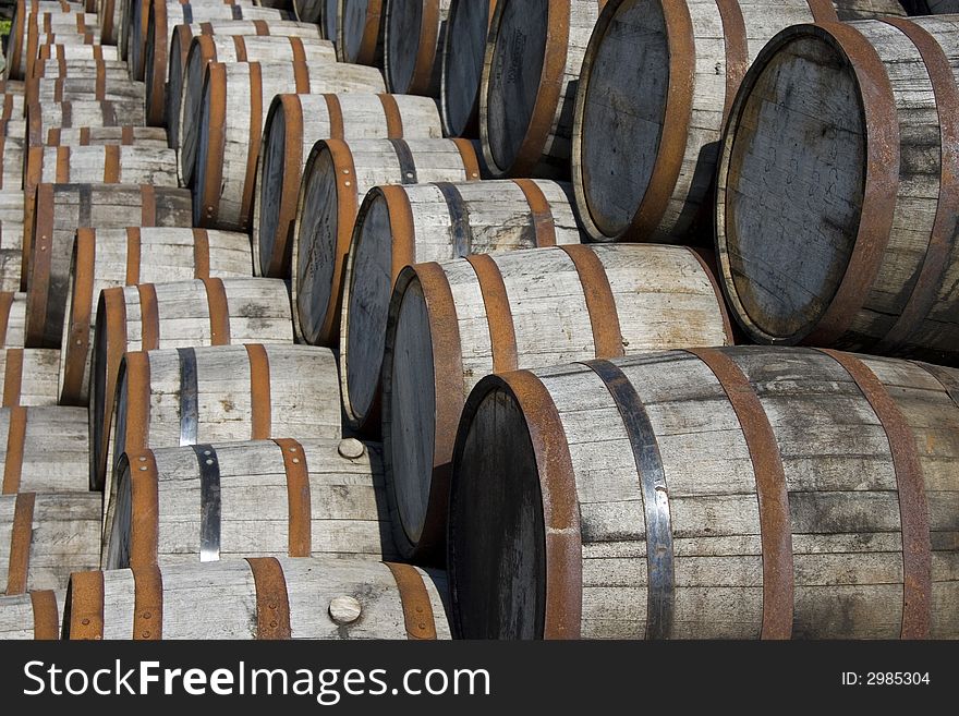 Stacked Whiskey Barrels Somewhere in Ireland. Stacked Whiskey Barrels Somewhere in Ireland