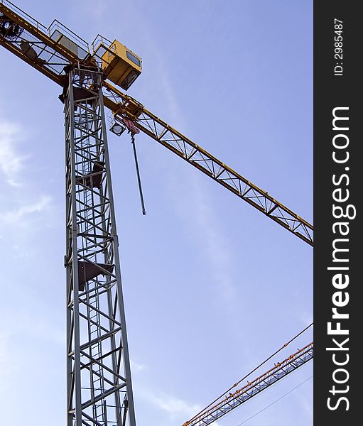 The building crane on a background of the sky. The building crane on a background of the sky