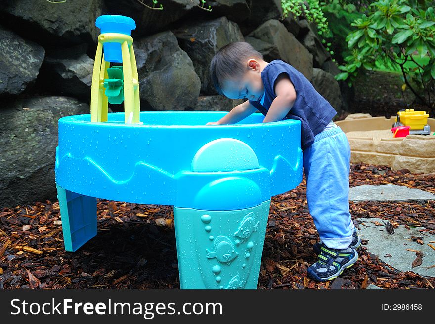 Child Playing in Water Activity Table. Child Playing in Water Activity Table