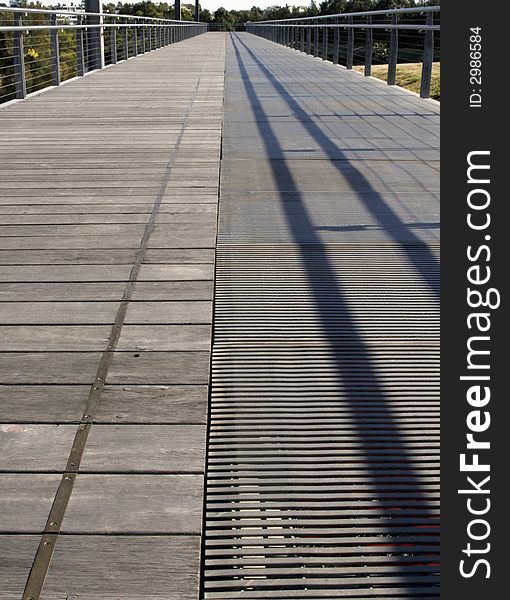 Long Footpath On A Wooden Bridge, Public Park