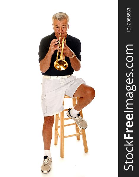Full body view of a senior man playing his trumpet.  Isolated on white. Full body view of a senior man playing his trumpet.  Isolated on white.
