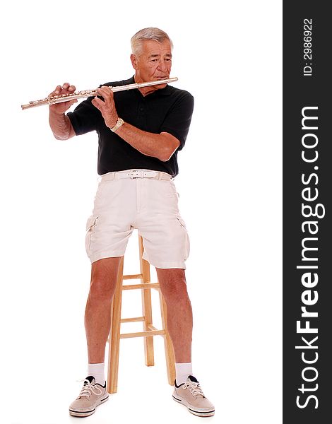 Full body portrait of a senior man playing his flute.  Isolated on white. Full body portrait of a senior man playing his flute.  Isolated on white.