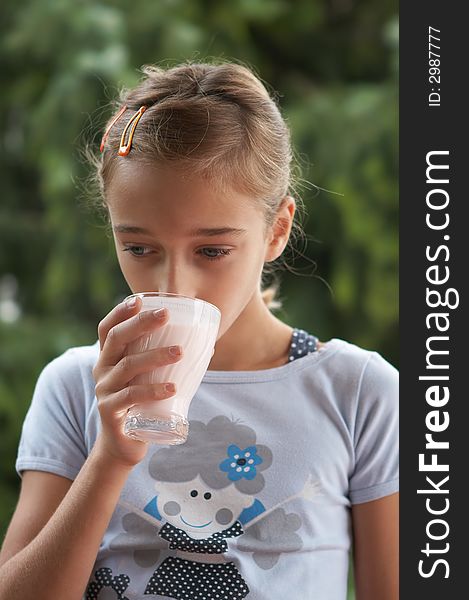 Girl drinking milk from the glass