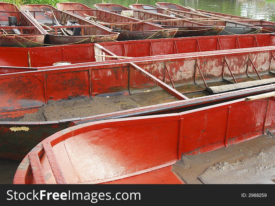 These boats are used to haul sand from the river. These boats are used to haul sand from the river