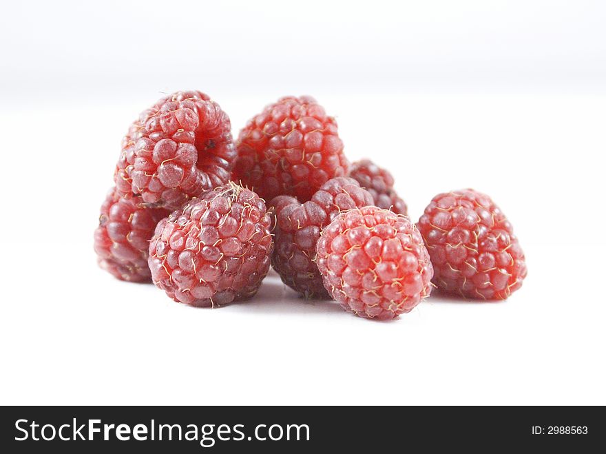 Red raspberries isolated on white background